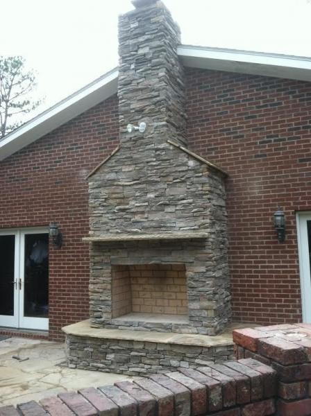 Have a great time entertaining your guests with this luxurious natural stone fireplace. 